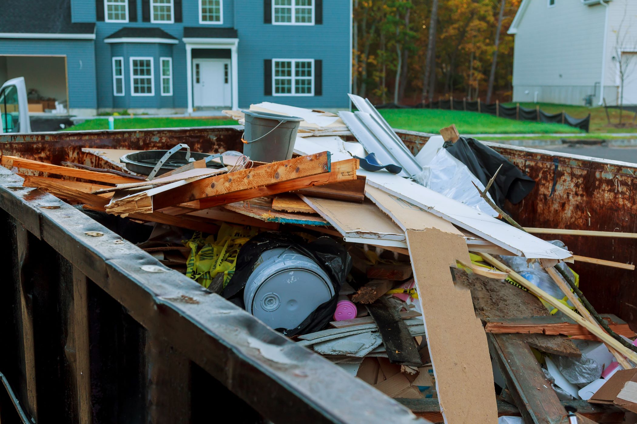 dumpster filled with garbage during a renovation